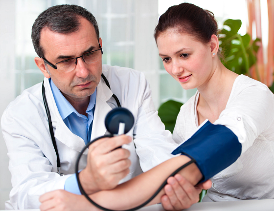 doctor getting the blood pressure of patient
